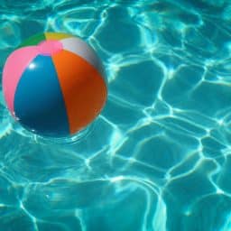 A beach ball floating in the water.