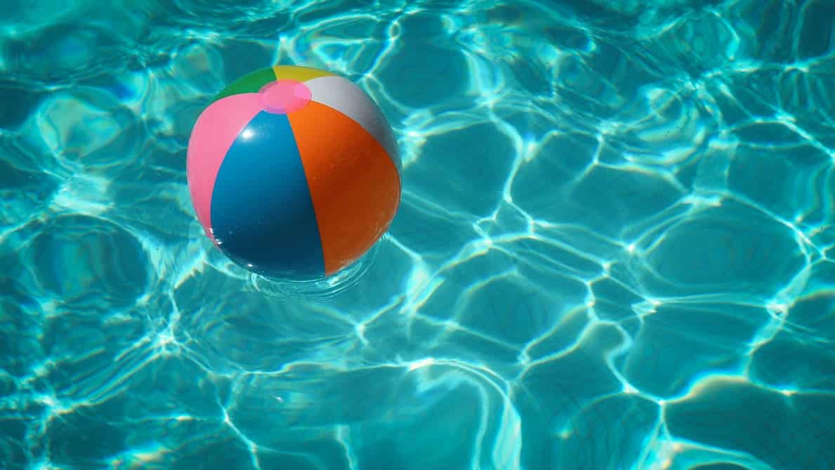 A beach ball floating in the water.